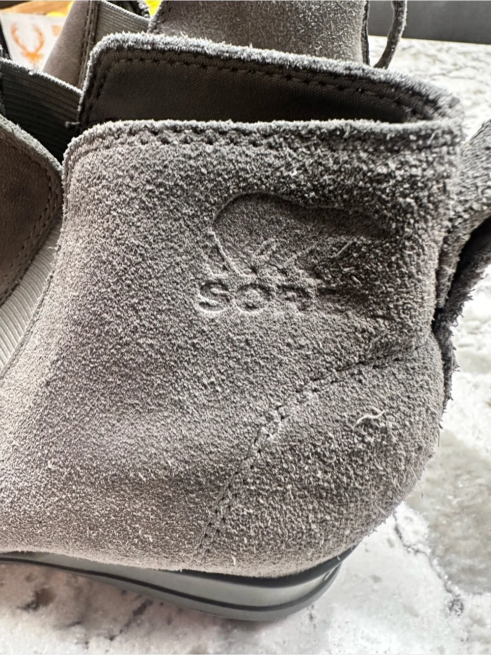 Sorel Evie II Chelsea waterproof boots in a gray leather and suede finish.
